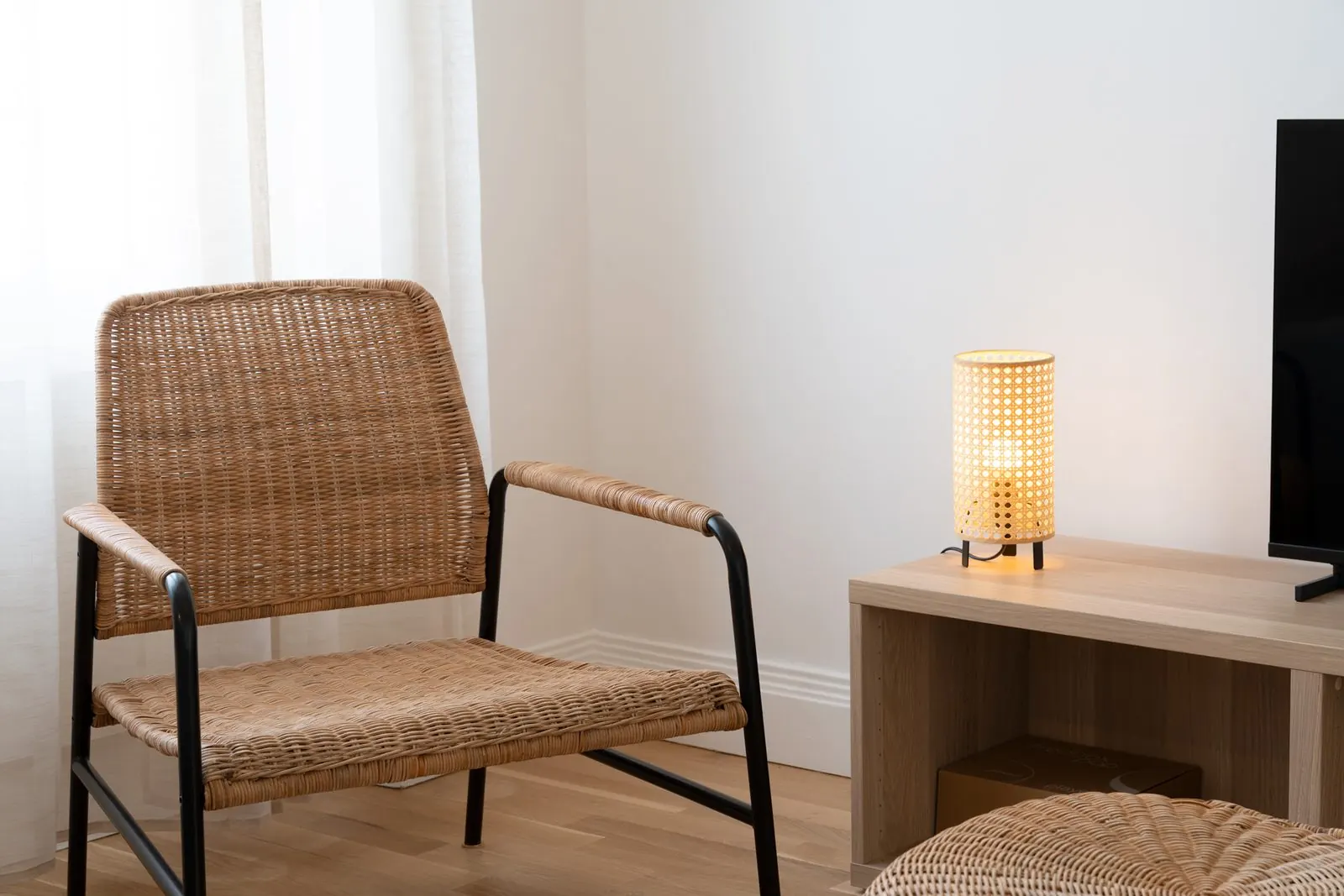 Artemis, furnished apartment, Nancy: rattan armchair and television unit