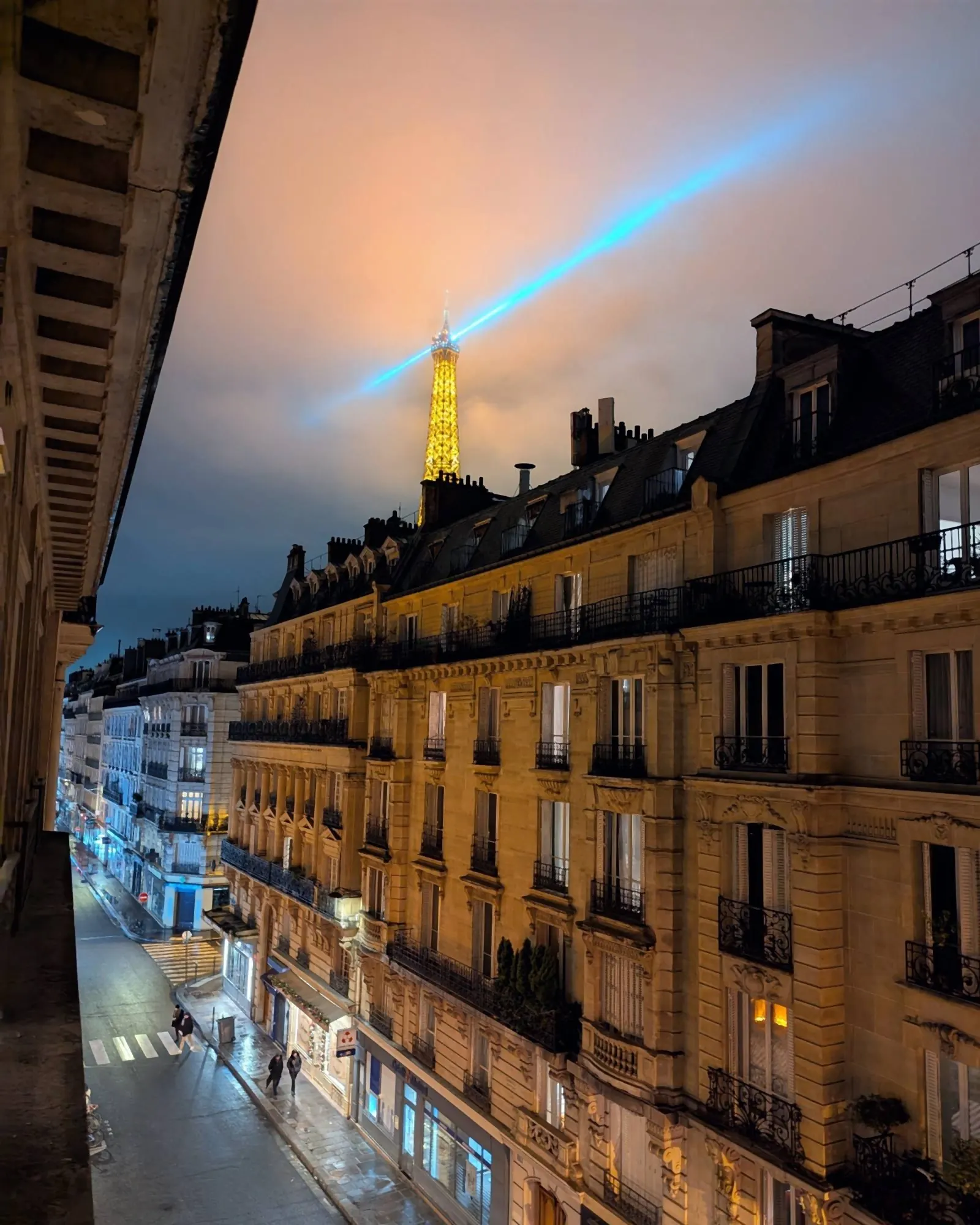 Le Gustave, furnished apartment, Paris 7th: the Eiffel Tower lit up at night, seen from the apartment window