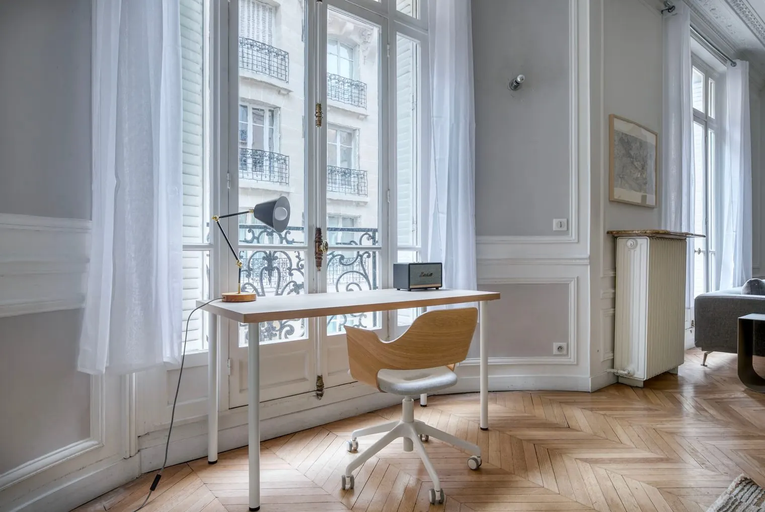 Corporate housing in Paris: a work desk by the tall windows at Le Monceau, furnished apartment, Paris 17th